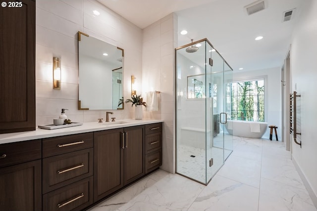 full bathroom with marble finish floor, a shower stall, and visible vents