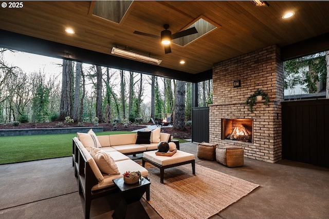 view of patio / terrace with an outdoor living space with a fireplace