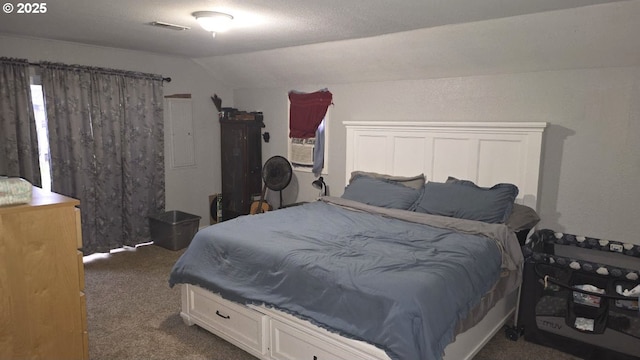 carpeted bedroom with vaulted ceiling