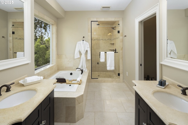 full bath featuring visible vents, a sink, a bath, and a shower stall