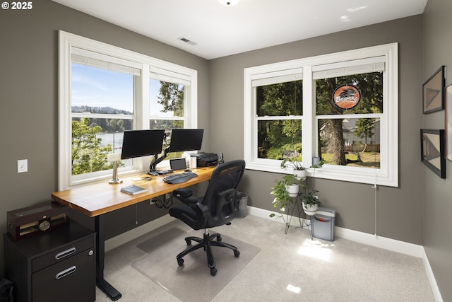 carpeted home office with baseboards and visible vents