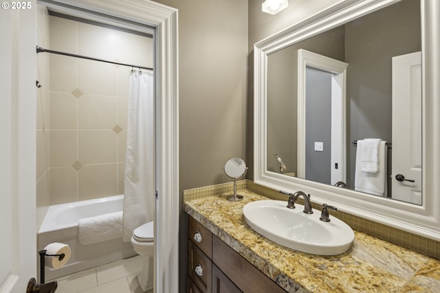 bathroom featuring toilet, tile patterned floors, shower / bath combo with shower curtain, and vanity
