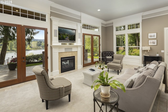 living room with recessed lighting, ornamental molding, and french doors