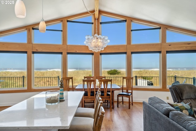 26280 Beach Dr, Rockaway Beach, OR 97136 - sunroom with lofted ceiling and a chandelier