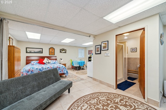 26280 Beach Dr, Rockaway Beach, OR 97136 - bedroom with light tile patterned floors and a drop ceiling