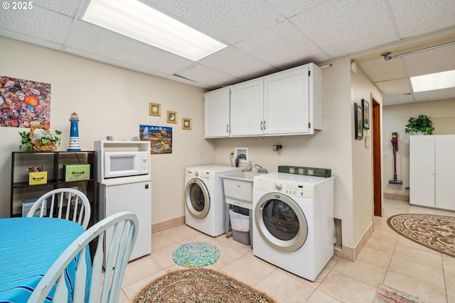 26280 Beach Dr, Rockaway Beach, OR 97136 - washroom with washer and dryer and light tile patterned flooring