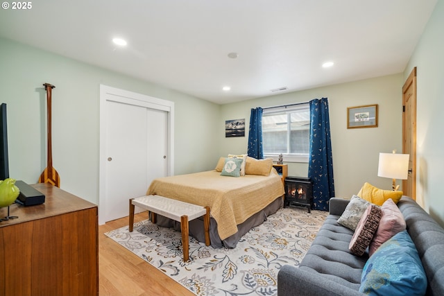 26280 Beach Dr, Rockaway Beach, OR 97136 - bedroom with light wood-style floors, recessed lighting, and a closet