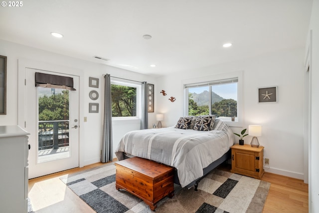 26280 Beach Dr, Rockaway Beach, OR 97136 - bedroom featuring access to exterior, light wood-type flooring, and recessed lighting