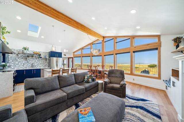 26280 Beach Dr, Rockaway Beach, OR 97136 - living room with light wood finished floors, healthy amount of natural light, recessed lighting, and a skylight