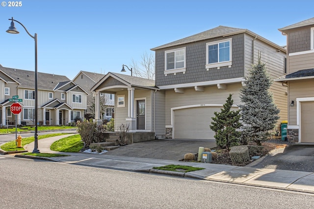 view of front of house featuring a garage, a residential view, and driveway