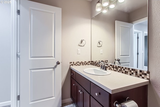 bathroom with vanity and backsplash