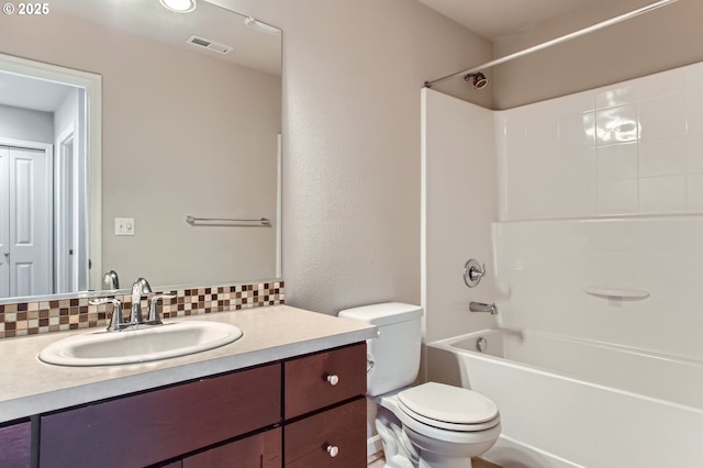 full bathroom with vanity, visible vents, bathing tub / shower combination, toilet, and backsplash