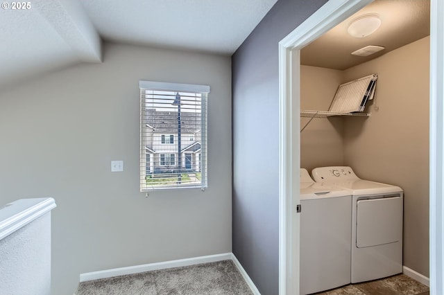 laundry room featuring baseboards, washing machine and dryer, and laundry area