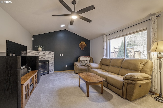 carpeted living room featuring ceiling fan and lofted ceiling