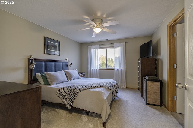 bedroom with light carpet and ceiling fan