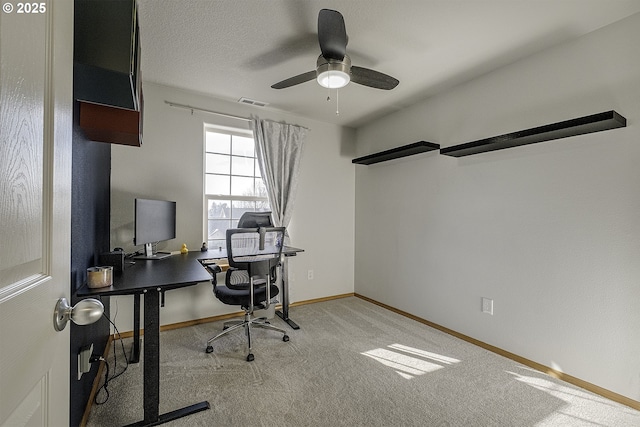 office area with carpet floors and ceiling fan