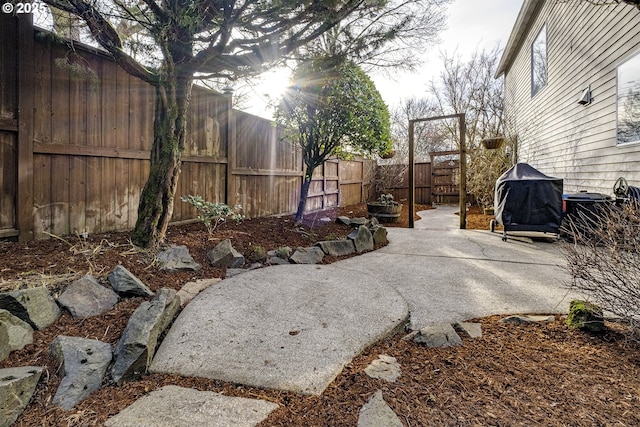 view of patio with a grill