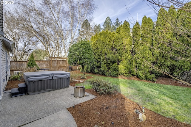 view of yard featuring a patio area and a hot tub