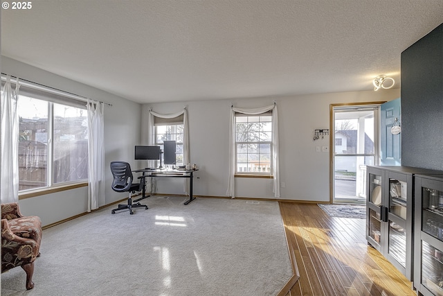 office area with a textured ceiling