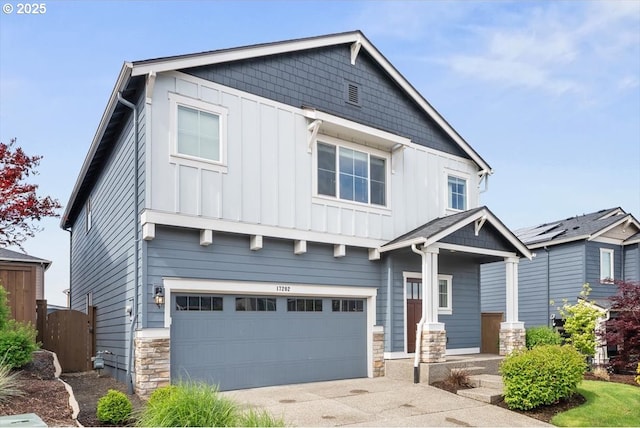 17202 NW Viola St, Portland, OR 97229 - craftsman-style house featuring board and batten siding, an attached garage, stone siding, and driveway