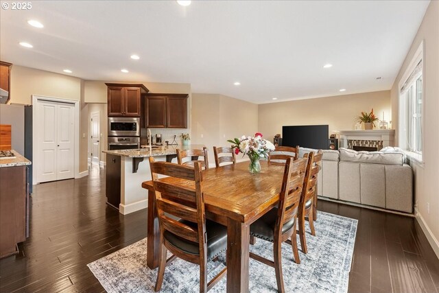17202 NW Viola St, Portland, OR 97229 - dining area with dark wood-type flooring, recessed lighting, and baseboards