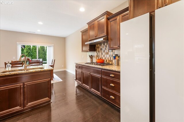 17202 NW Viola St, Portland, OR 97229 - kitchen featuring a sink, stainless steel gas stovetop, baseboards, tasteful backsplash, and recessed lighting