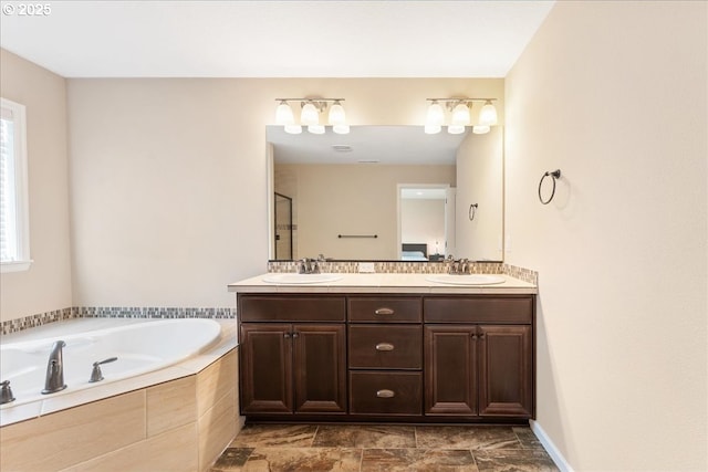 17202 NW Viola St, Portland, OR 97229 - bathroom with a bath, double vanity, and stone finish floors