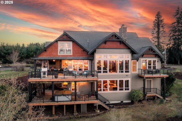 back of property with crawl space, a chimney, stairway, and a deck