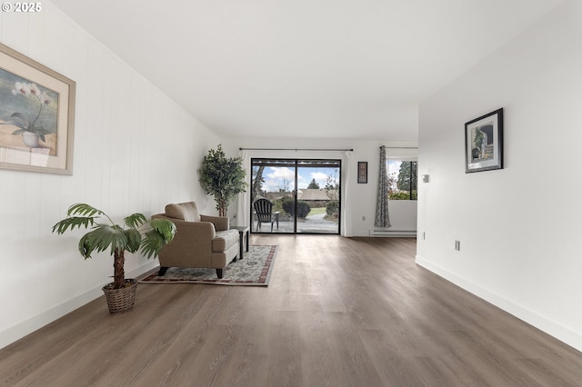 sitting room with wood-type flooring