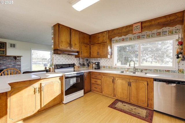 5704 Keene Rd NE, Gervais, OR 97026 - kitchen featuring electric range, stainless steel dishwasher, a sink, light wood finished floors, and light countertops
