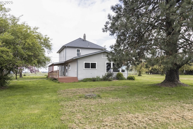 5704 Keene Rd NE, Gervais, OR 97026 - rear view of property featuring a lawn, a chimney, and a wooden deck