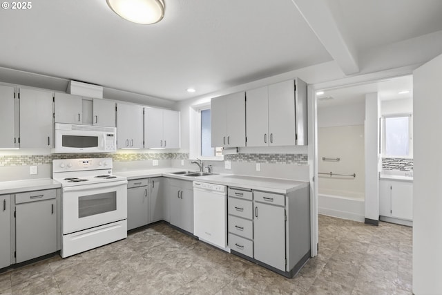 1570 Blaine St, Woodburn, OR 97071 - kitchen with white appliances, decorative backsplash, healthy amount of natural light, and recessed lighting