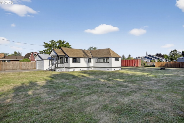 1570 Blaine St, Woodburn, OR 97071 - rear view of house with a shed, a fenced backyard, and a detached garage
