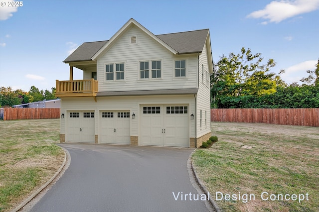 1570 Blaine St, Woodburn, OR 97071 - view of front facade with an attached garage, asphalt driveway, and a balcony