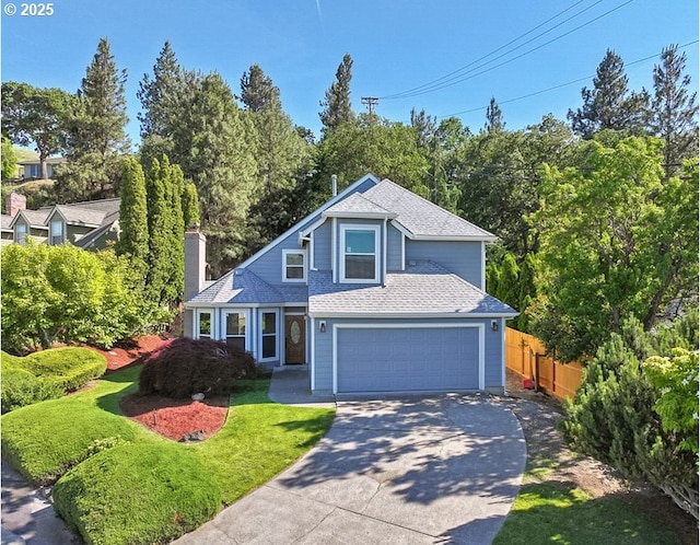 1904 Quinton St, The Dalles, OR 97058 - traditional home with concrete driveway, a chimney, roof with shingles, and a garage