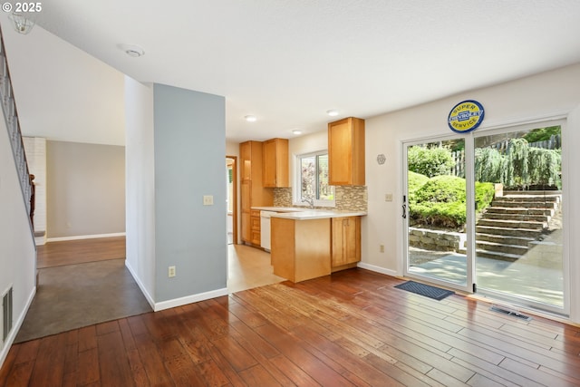 1904 Quinton St, The Dalles, OR 97058 - kitchen featuring hardwood / wood-style floors, light countertops, baseboards, a peninsula, and recessed lighting