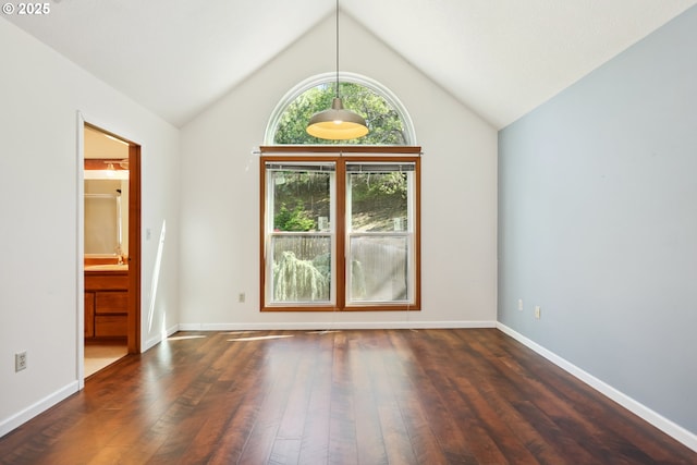 1904 Quinton St, The Dalles, OR 97058 - empty room with wood-type flooring, vaulted ceiling, and baseboards