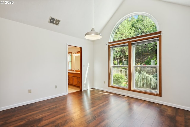 1904 Quinton St, The Dalles, OR 97058 - spare room featuring wood finished floors, vaulted ceiling, and baseboards