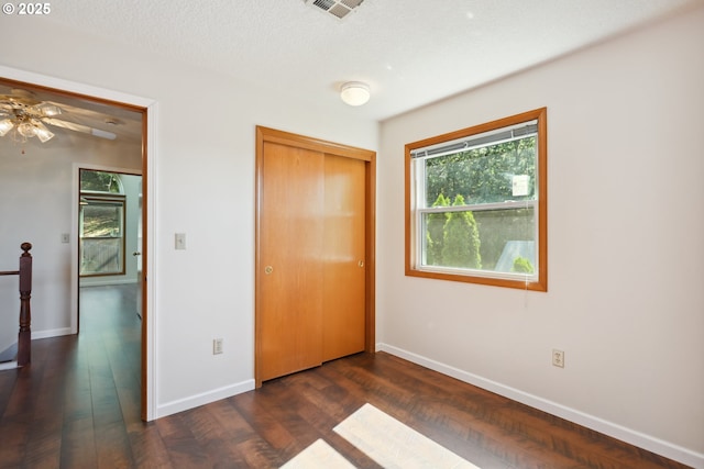 1904 Quinton St, The Dalles, OR 97058 - unfurnished bedroom featuring baseboards, dark wood finished floors, and a closet