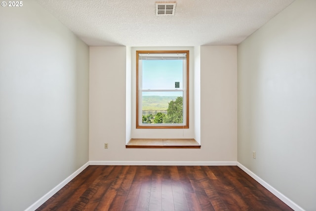 1904 Quinton St, The Dalles, OR 97058 - spare room with hardwood / wood-style flooring, baseboards, and a textured ceiling