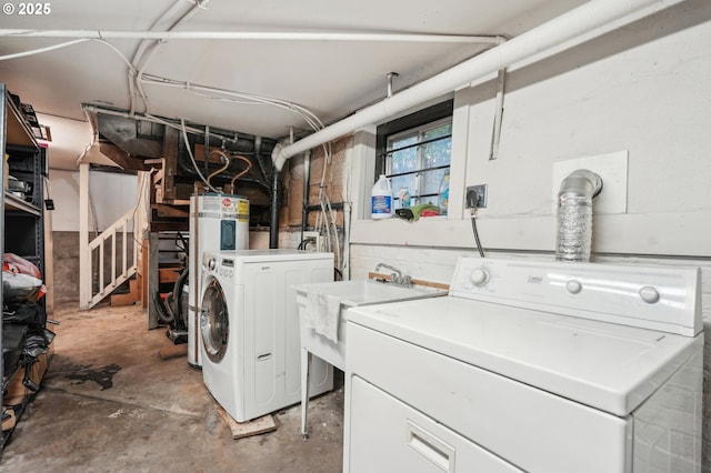 laundry room featuring separate washer and dryer