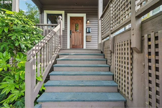 doorway to property featuring covered porch