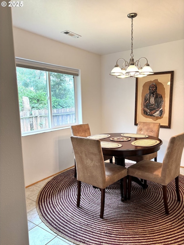 17239 Lumberview Rd, Brookings, OR 97415 - dining space with a chandelier and tile patterned flooring