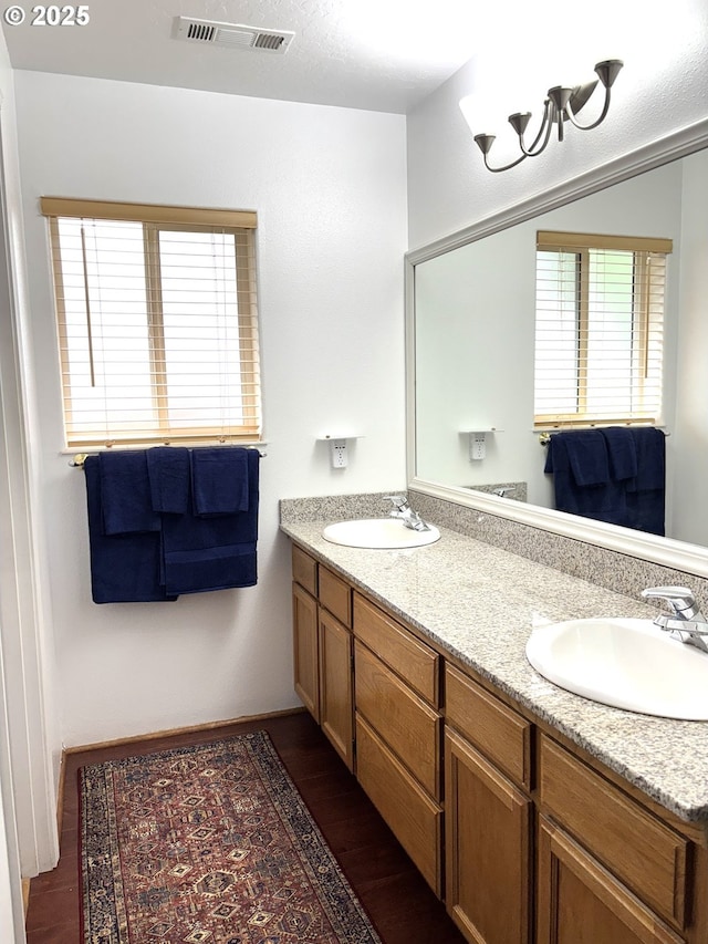 17239 Lumberview Rd, Brookings, OR 97415 - bathroom with wood finished floors and double vanity