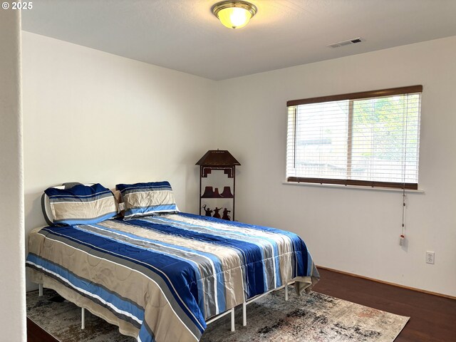 17239 Lumberview Rd, Brookings, OR 97415 - bedroom featuring wood finished floors