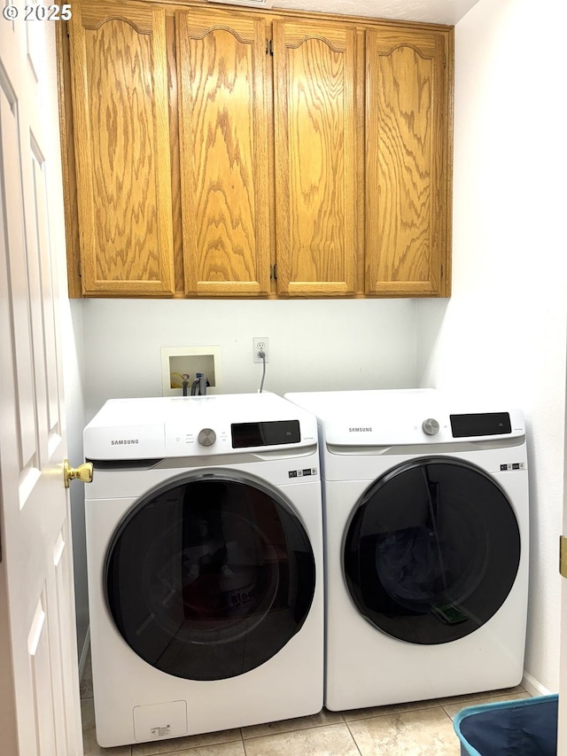 17239 Lumberview Rd, Brookings, OR 97415 - laundry area with washer and dryer, cabinet space, and light tile patterned flooring