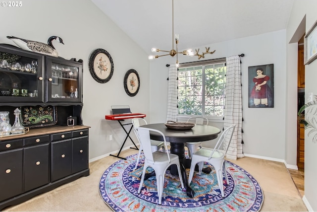 dining room featuring vaulted ceiling, baseboards, and an inviting chandelier