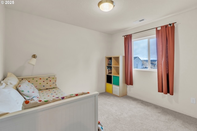 bedroom with light carpet and visible vents