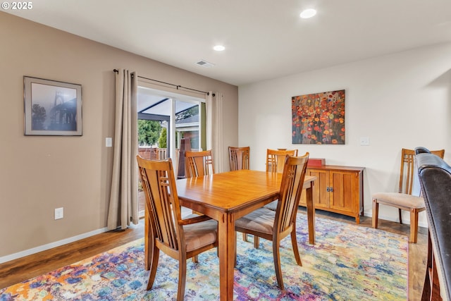 dining area with recessed lighting, light wood-type flooring, visible vents, and baseboards