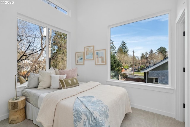 bedroom with carpet floors and baseboards